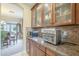 Kitchen features built-in microwave and air fryer, granite counters, and wood cabinets at 3151 E Turnberry Dr, Gilbert, AZ 85298