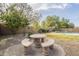 Stone patio with round table and benches, perfect for relaxing at 3151 E Turnberry Dr, Gilbert, AZ 85298