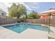 Relaxing rectangular pool with water features and umbrellas at 3151 E Turnberry Dr, Gilbert, AZ 85298