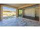 Covered patio with gray tile flooring, offering an outdoor living space at 316 E Leverenz Ave, Queen Creek, AZ 85140