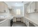 Functional laundry room, with ample counter and cabinet storage at 316 E Leverenz Ave, Queen Creek, AZ 85140