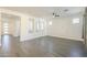 Bright living room with wood-look tile flooring at 316 E Leverenz Ave, Queen Creek, AZ 85140