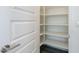 Walk-in pantry with ample shelving for storage at 316 E Leverenz Ave, Queen Creek, AZ 85140