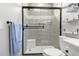 Modern bathroom with a walk-in shower and built-in shelves at 31828 N Ash St, Wittmann, AZ 85361