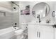 Clean bathroom with a bathtub, toilet, and modern vanity at 31828 N Ash St, Wittmann, AZ 85361