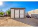 Closed storage shed in backyard at 31828 N Ash St, Wittmann, AZ 85361