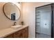 Modern bathroom with white subway tile, floating vanity, and large mirror at 32633 N 137Th St, Scottsdale, AZ 85262