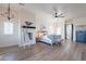 Main bedroom with wood floors, fireplace, and stunning views at 32633 N 137Th St, Scottsdale, AZ 85262