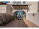 Elegant entryway with arched doorway and landscaping at 32633 N 137Th St, Scottsdale, AZ 85262