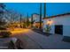 Landscaped pathway leading to the home's entrance at night at 32633 N 137Th St, Scottsdale, AZ 85262