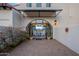 Elegant front entrance with arched doorway and view to dining area at 32633 N 137Th St, Scottsdale, AZ 85262