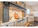 Kitchen features a unique range hood and custom cabinetry at 32633 N 137Th St, Scottsdale, AZ 85262