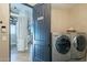 Convenient laundry room with washer, dryer, and additional storage at 32633 N 137Th St, Scottsdale, AZ 85262