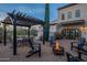 Outdoor patio with pergola, fire pit, and seating at 32633 N 137Th St, Scottsdale, AZ 85262