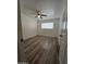 Large bedroom with ceiling fan and wood-look floors at 3408 W Mclellan Blvd, Phoenix, AZ 85017