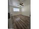 Well-lit bedroom, ceiling fan, wood-look floors at 3408 W Mclellan Blvd, Phoenix, AZ 85017