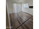 Living area with wood-look floors and sliding glass doors at 3408 W Mclellan Blvd, Phoenix, AZ 85017