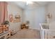 Charming bedroom featuring a crib and playful decor at 3419 W Dreamy Draw Dr, San Tan Valley, AZ 85144