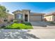 One-story home with a two-car garage and landscaped front yard at 3419 W Dreamy Draw Dr, San Tan Valley, AZ 85144