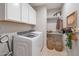 Bright laundry room with washer, dryer, and ample storage at 3419 W Dreamy Draw Dr, San Tan Valley, AZ 85144