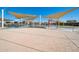 Community pool with shade structures and splash pad at 3419 W Dreamy Draw Dr, San Tan Valley, AZ 85144