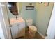 Small bathroom with white vanity, toilet and teal walls at 3432 E Bartlett Dr, Gilbert, AZ 85234