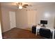 Bedroom with carpeted floor, ceiling fan, and workspace at 3432 E Bartlett Dr, Gilbert, AZ 85234