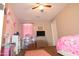 bedroom with TV, dresser, and playful decor at 3432 E Bartlett Dr, Gilbert, AZ 85234