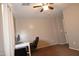 Bedroom with carpeted floor, ceiling fan, and workspace at 3432 E Bartlett Dr, Gilbert, AZ 85234