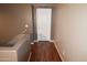 Light-colored hallway with wood-look floors and neutral walls at 3432 E Bartlett Dr, Gilbert, AZ 85234