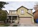 Two story house with tan exterior, attached garage, and landscaping at 3432 E Bartlett Dr, Gilbert, AZ 85234