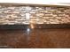 Dark brown granite countertop and backsplash detail at 3432 E Bartlett Dr, Gilbert, AZ 85234