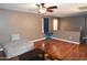 Bright living room with hardwood floors and a ceiling fan at 3432 E Bartlett Dr, Gilbert, AZ 85234