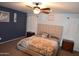 Main bedroom with a king-size bed and calming blue and beige decor at 3432 E Bartlett Dr, Gilbert, AZ 85234