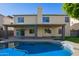 Home features a sparkling pool and spacious covered patio at 3947 N Carnation Ln, Avondale, AZ 85392