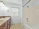 Bathroom with tub, double vanity, and granite top at 3947 N Carnation Ln, Avondale, AZ 85392