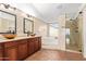 Spa-like bathroom with double vanity and walk-in shower at 3947 N Carnation Ln, Avondale, AZ 85392