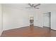 Bedroom with wood floors, ceiling fan, and closet at 3947 N Carnation Ln, Avondale, AZ 85392