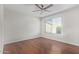 Bedroom with wood floors and ceiling fan at 3947 N Carnation Ln, Avondale, AZ 85392