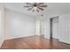 Spacious bedroom with wood floors and ceiling fan at 3947 N Carnation Ln, Avondale, AZ 85392