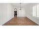 Dining room with tile floors, chandelier, and kitchen access at 3947 N Carnation Ln, Avondale, AZ 85392