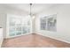 Dining area with tile floors, sliding doors, and chandelier at 3947 N Carnation Ln, Avondale, AZ 85392