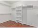 Large walk-in closet with shelves and hanging rods at 3947 N Carnation Ln, Avondale, AZ 85392