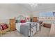 Cozy bedroom with iron bed frame and wood furniture at 4102 E Ray Rd # 1006, Phoenix, AZ 85044