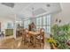 Dining area with a wooden table and chairs, and a view into the kitchen at 4102 E Ray Rd # 1006, Phoenix, AZ 85044