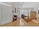 Living room with fireplace, large window, and wooden furniture at 4102 E Ray Rd # 1006, Phoenix, AZ 85044