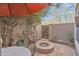 Charming patio features fire pit and lush landscaping at 4102 E Ray Rd # 1006, Phoenix, AZ 85044