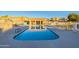 Community pool with surrounding lounge chairs at 4102 E Ray Rd # 1006, Phoenix, AZ 85044