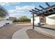 Landscaped backyard with a pergola and walkway at 4205 E Peak View Rd, Cave Creek, AZ 85331