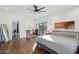 Main bedroom with king bed, ensuite bathroom access, and polished concrete floors at 4205 E Peak View Rd, Cave Creek, AZ 85331